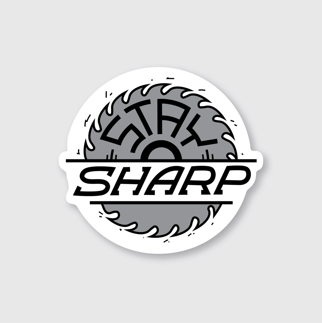 The "Stay Sharp Saw Sticker" is designed by Pike Street Press and features a circular motif with a stylized saw blade and the phrase "STAY SHARP." Crafted by independent artists, this sticker includes a gray and black monochromatic design set against a light gray background. It is designed to be both water- and weather-resistant.
