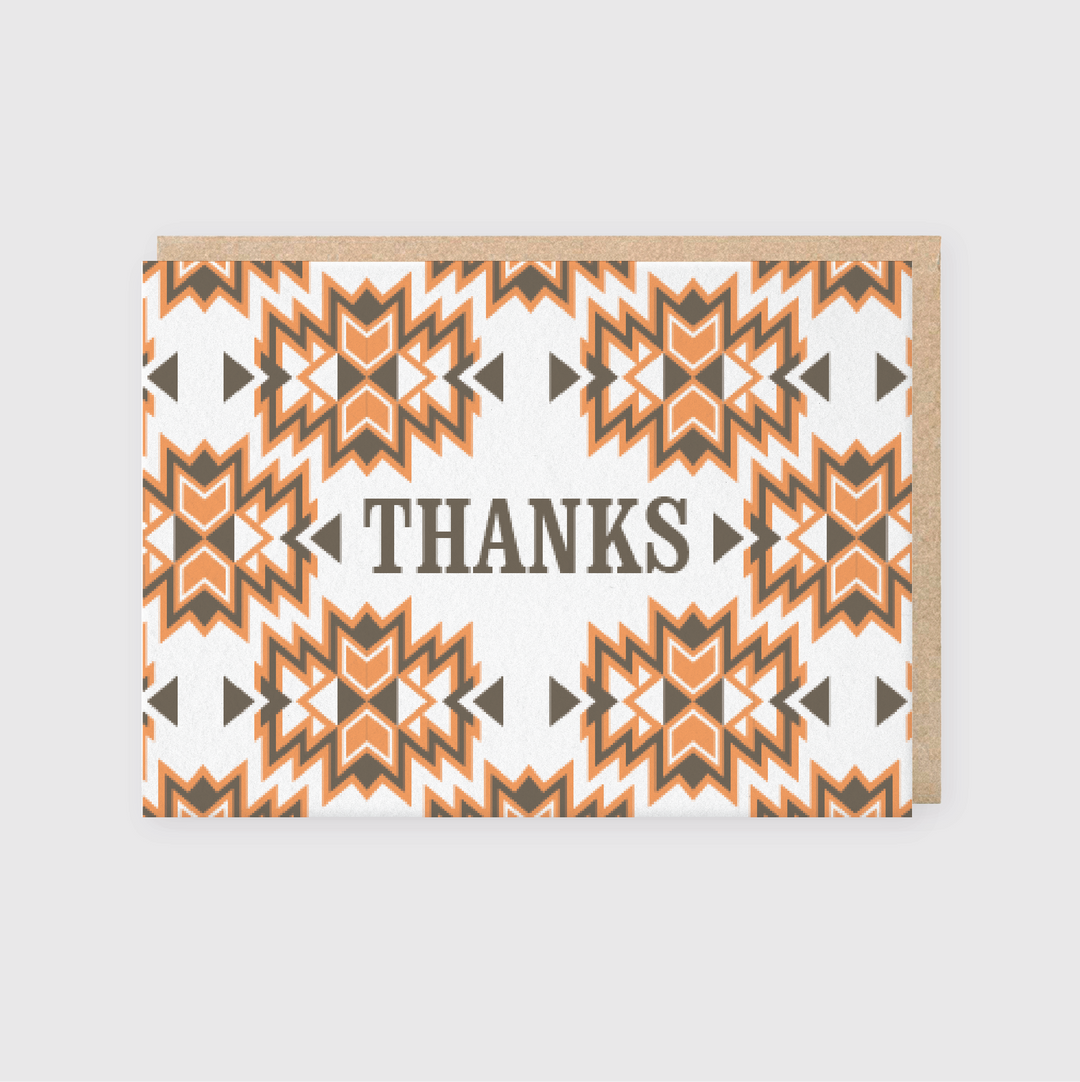 The Thanks Orange Brown Pattern Greeting Card is a beautifully handcrafted item from Seattle, showcasing a geometric design in orange, brown, and white. The card is elegantly folded with a kraft paper edge and prominently features the word "THANKS" at its center, offering an appealing combination of style and gratitude.