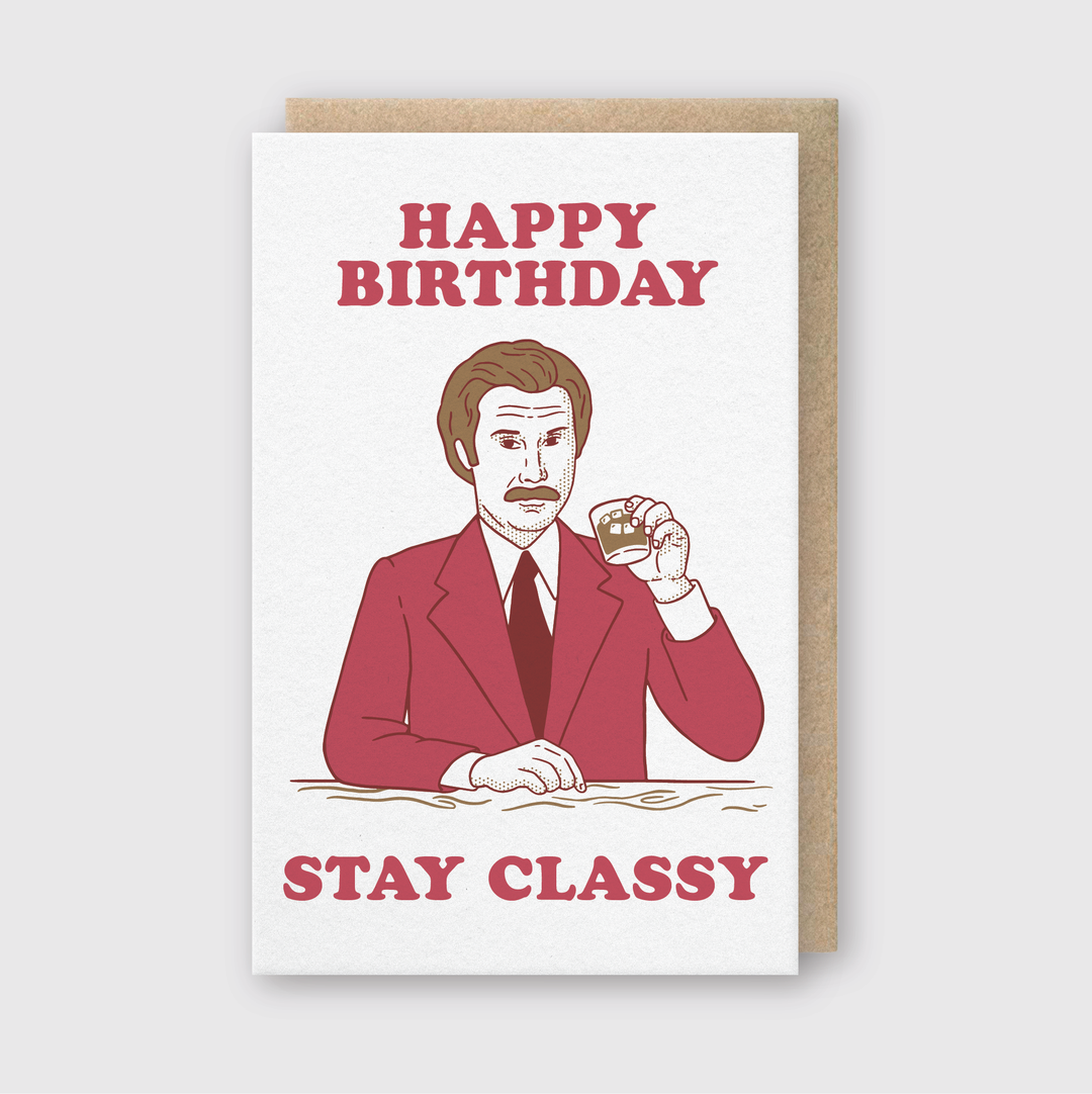 The greeting card features an illustration of a man in a suit holding a glass. The text "Happy Birthday Stay Classy" is elegantly displayed above and below the image on a light background, highlighting the charm of letterpress techniques.