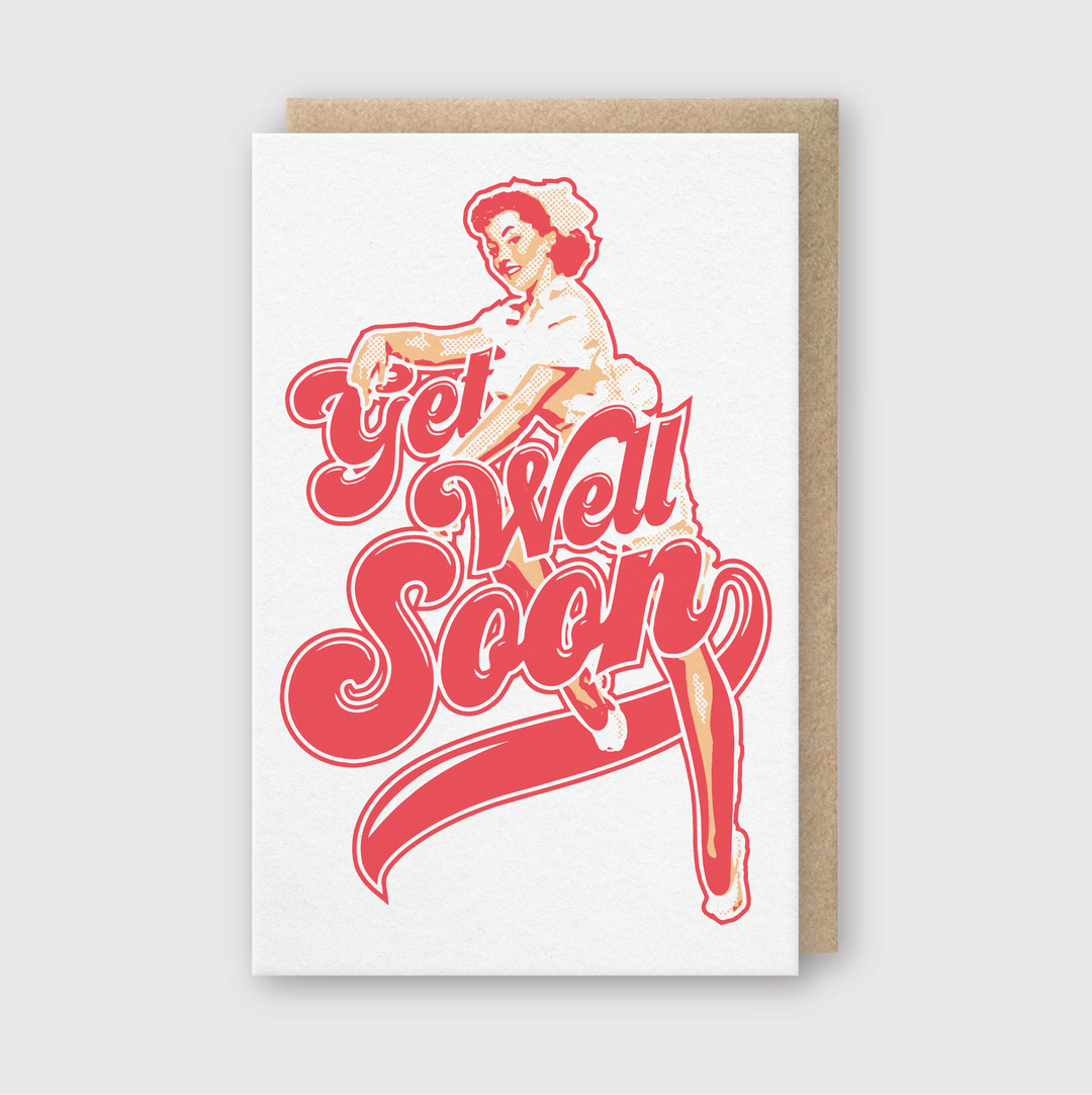 This Get Well Nurse Greeting Card features a whimsical design with a woman in a vintage outfit striking a playful pose. Below her figure, bold text "Get Well Soon" appears in red flowing script. Handcrafted with soy-based inks on a light gray background, this card exudes charming nostalgia.