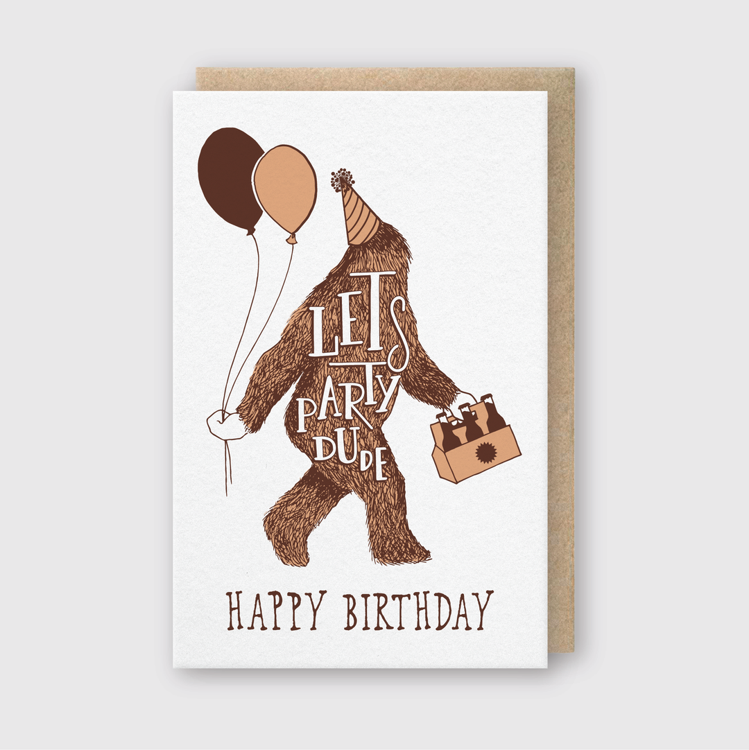 Introducing the "Happy Birthday Sasquatch Greeting Card." This card features a Sasquatch in a party hat, holding balloons and a gift bag. The phrases "Let's Party Dude" and "Happy Birthday Sasquatch" are elegantly crafted using letterpress techniques on a white background with a brown border for an extra special touch.