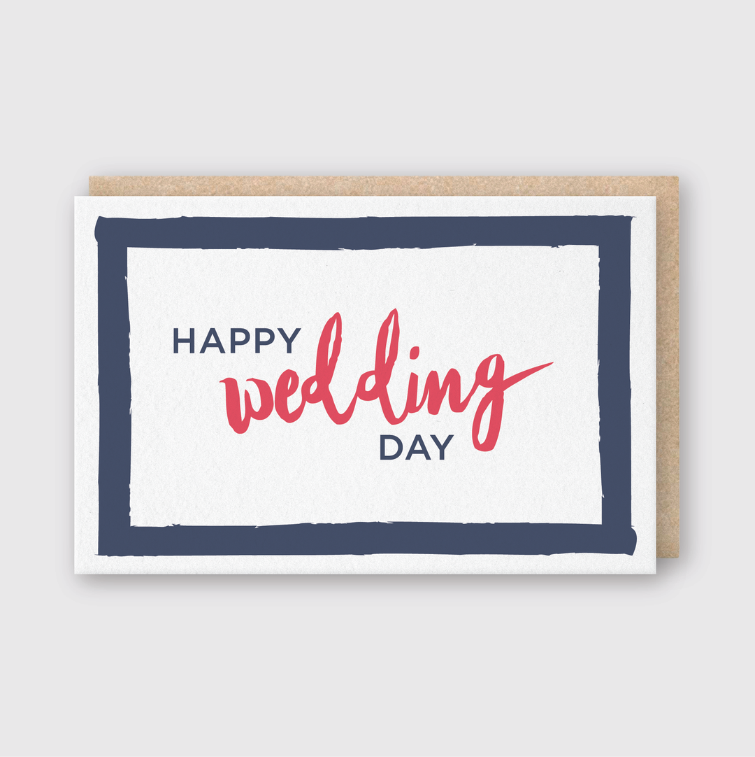The "Happy Wedding Day Greeting Card" is a handcrafted design from Seattle, featuring "Happy Wedding Day" in vibrant blue and red letters. The card's aesthetic is enhanced with a navy blue border on a white background, and it comes paired with a rustic brown envelope.