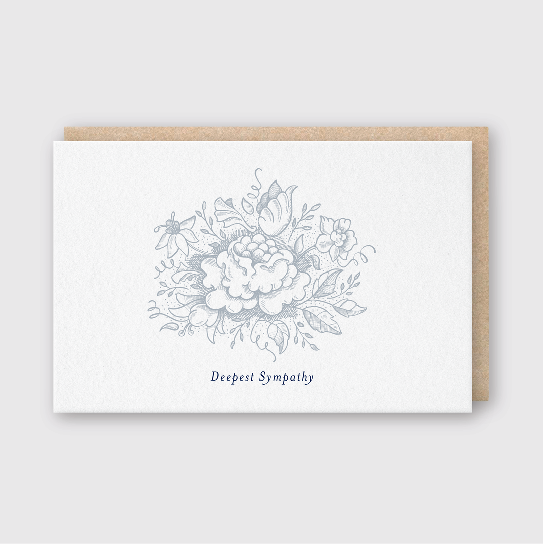 The Sympathy Flower Greeting Card features a handcrafted design with a floral illustration in shades of gray on the front. The words "Deepest Sympathy" are elegantly printed in blue beneath the flowers, offering heartfelt condolences. This thoughtful card comes with a brown envelope, adding warmth and care to your message.