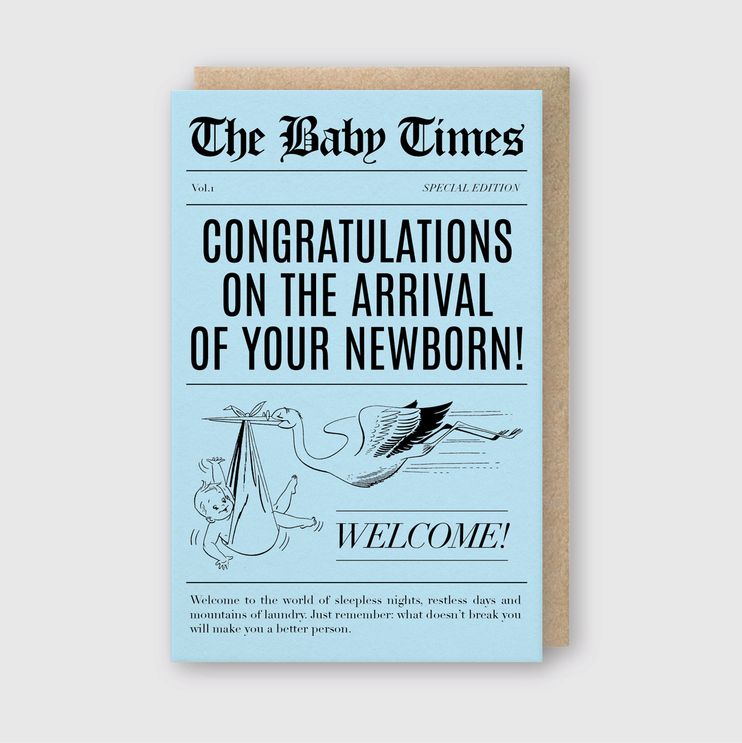 The "Baby Times Blue Greeting Card" is a light blue, newspaper-style card designed to welcome a newborn. It features an illustration of a stork carrying a baby along with the headline "Congratulations on the arrival of your newborn!" Additionally, the card includes a humorous note about sleepless nights and laundry, capturing both the joy and chaos of welcoming a new baby.