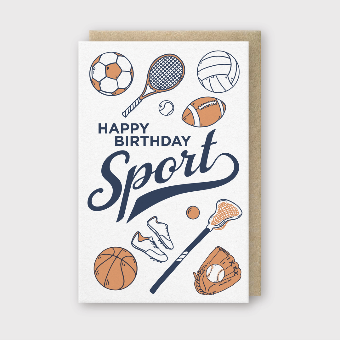 The "Happy Birthday Sport Greeting Card" features vibrant illustrations of sports equipment like soccer balls, tennis rackets, and footballs. Perfect for sports enthusiasts, this card brings the excitement of the game to life with its dynamic design.