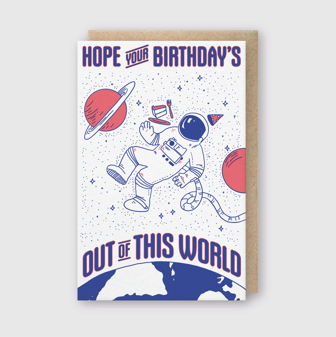 The "Out of this World Greeting Card" showcases an astronaut donning a party hat, floating amidst stars and planets. The design captures the essence of cosmic celebrations with the message: "Hope your birthday's out of this world!