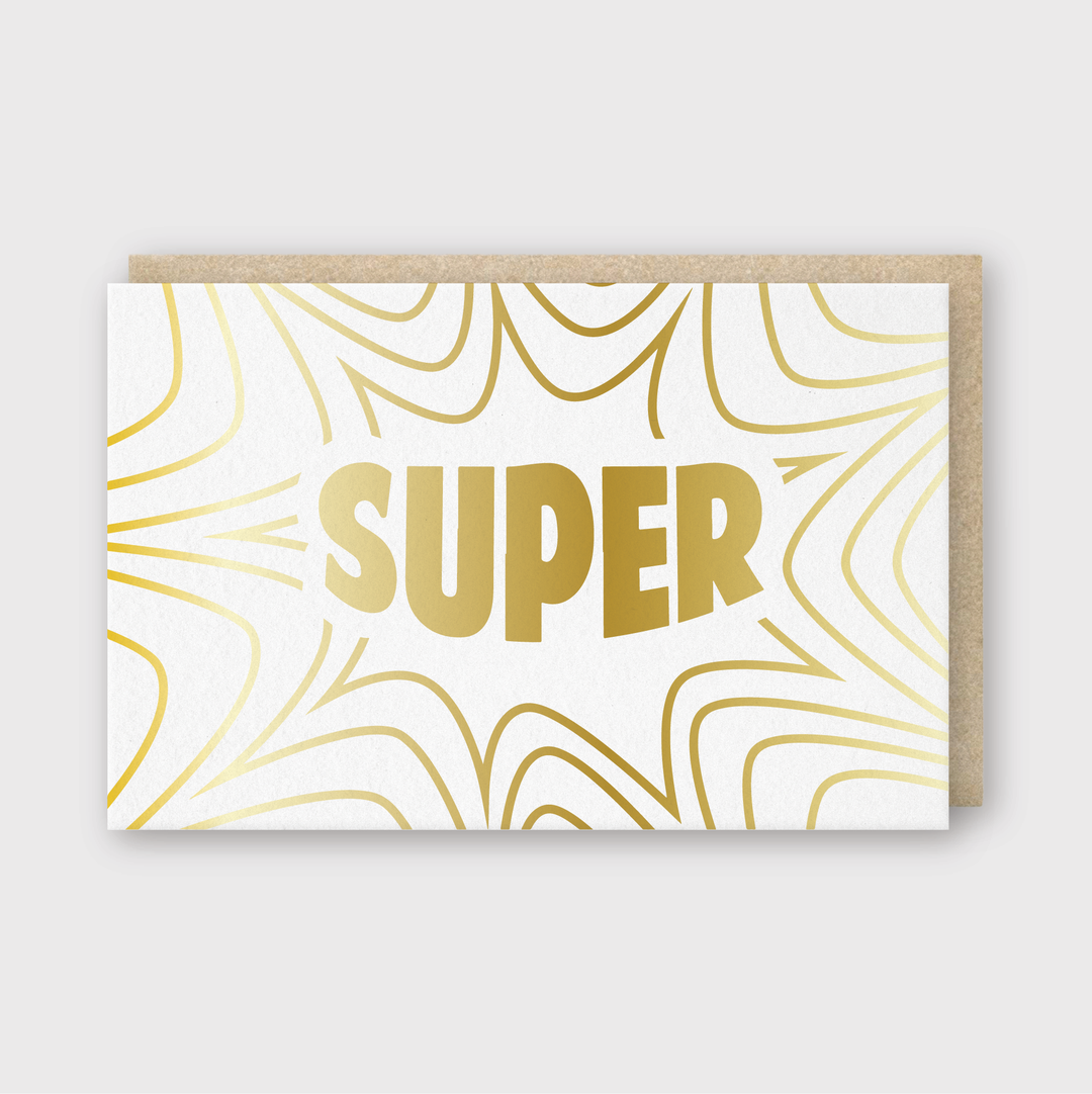 The "Super Foil Greeting Card" boasts a striking design with bold gold text reading "SUPER" at the center of a white front. Radiating from the text are abstract gold swirl patterns that add charm to the background. This elegant presentation is complemented by a brown kraft paper envelope peeking out from behind.