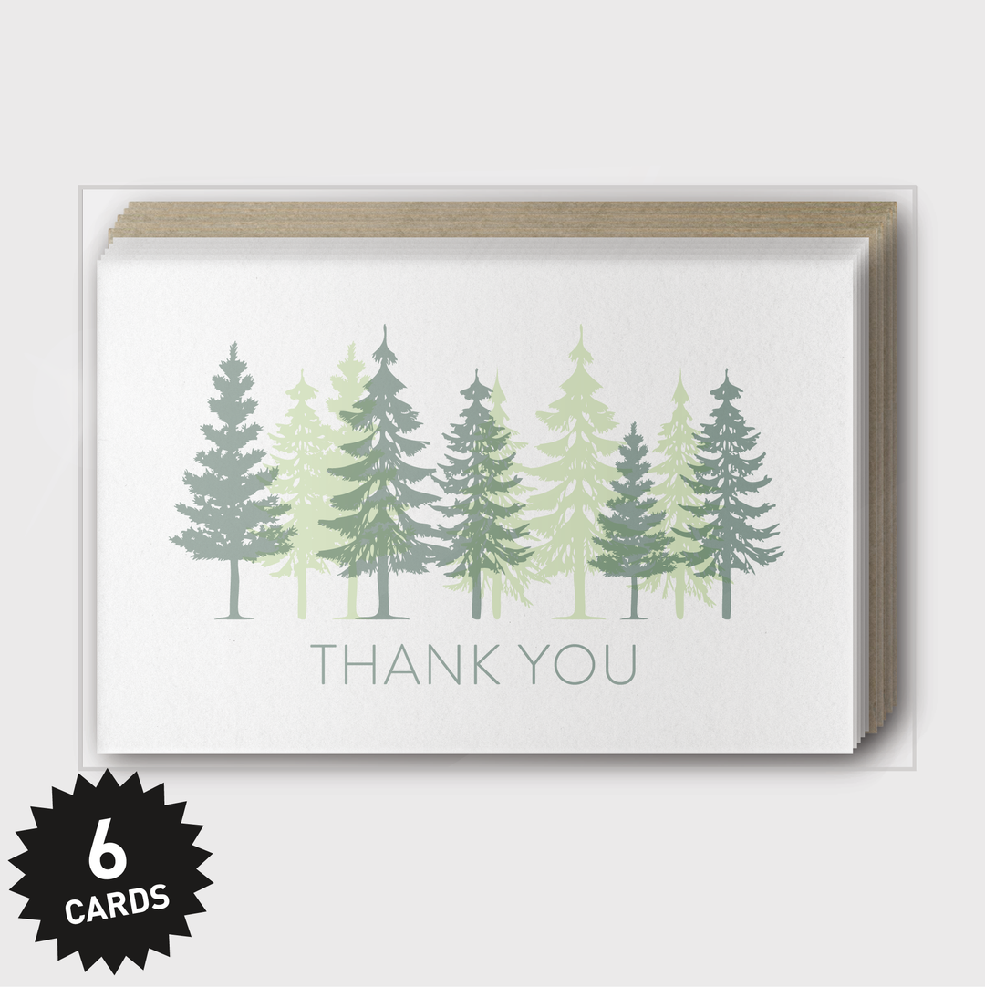 The image displays the "Thank You Trees Overprint Greeting Cards," featuring a set of six cards. Each card is decorated with evergreen trees in rich green shades, and "THANK YOU" is elegantly letterpressed in light gray below the trees. A black starburst on the bottom left highlights "6 CARDS," underscoring their handcrafted charm.