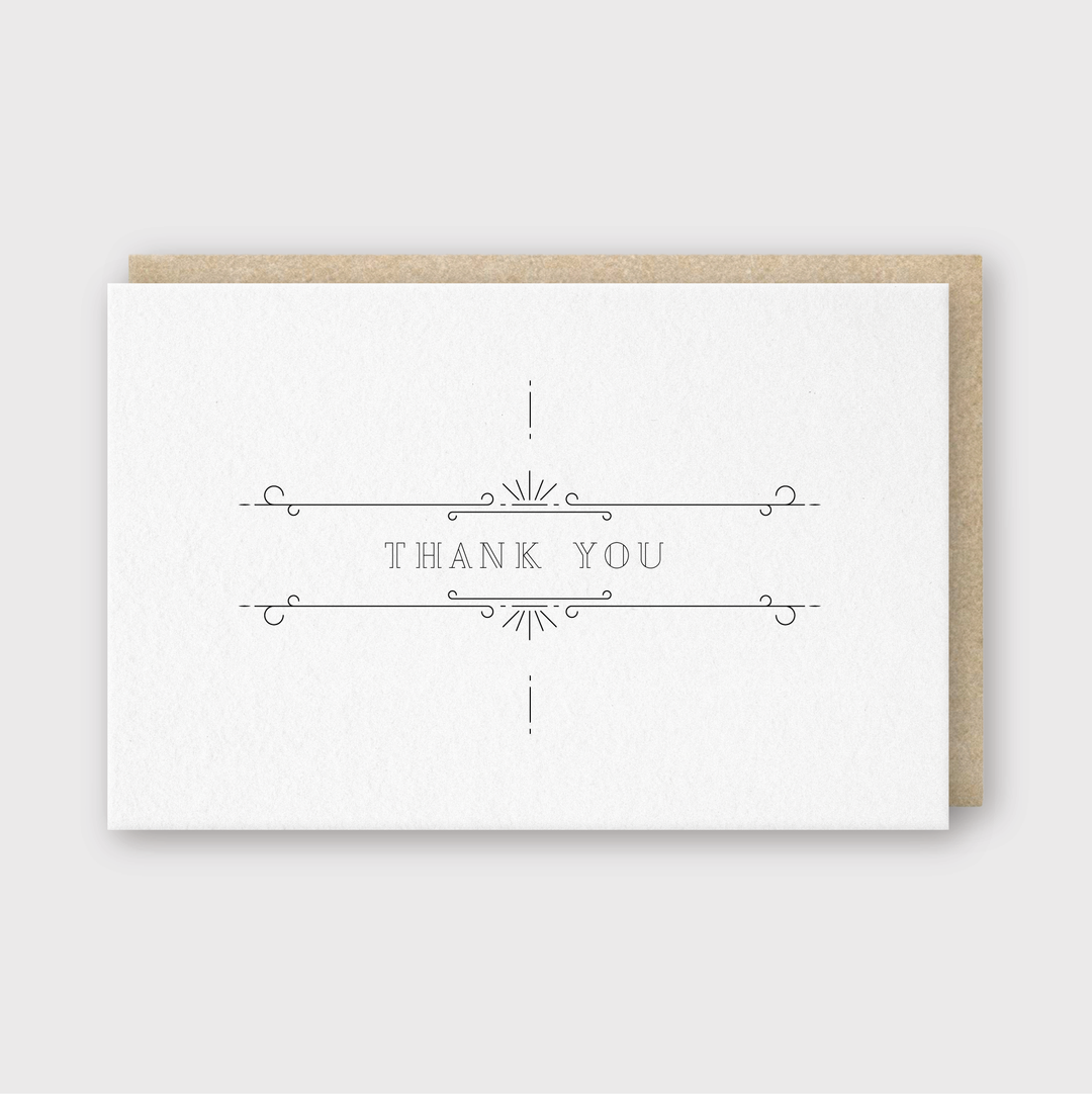 Introducing the Thank You Ornate Grey Greeting Card, a handcrafted minimalist card featuring elegant letterpress lettering. It showcases simple decorative lines and comes with a brown envelope, all set against a light gray background.
