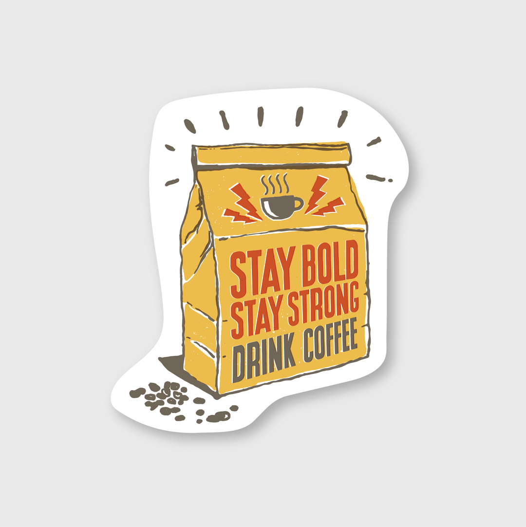 The "Stay Bold Coffee Sticker" features a brown coffee bag with the phrase "Stay Bold, Stay Strong, Drink Coffee" in vibrant red and yellow. It includes embellishments like lightning bolts and a steaming cup icon, with coffee beans scattered at the bottom. The sticker is made from die-cut vinyl to withstand various weather conditions and has a white background for striking contrast, making it ideal for coffee enthusiasts.