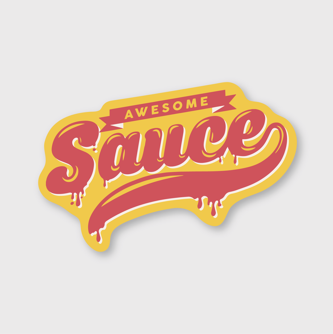 This die-cut vinyl sticker, called the "Awesome Sauce Sticker," features a stylized design with the phrase "Awesome Sauce" in bold, retro lettering. The word "Awesome" is displayed on a red banner above "Sauce," which is illustrated in large, dripping pinkish-red letters outlined in yellow against a light background. It is printed in Seattle and offers water and weather resistance.