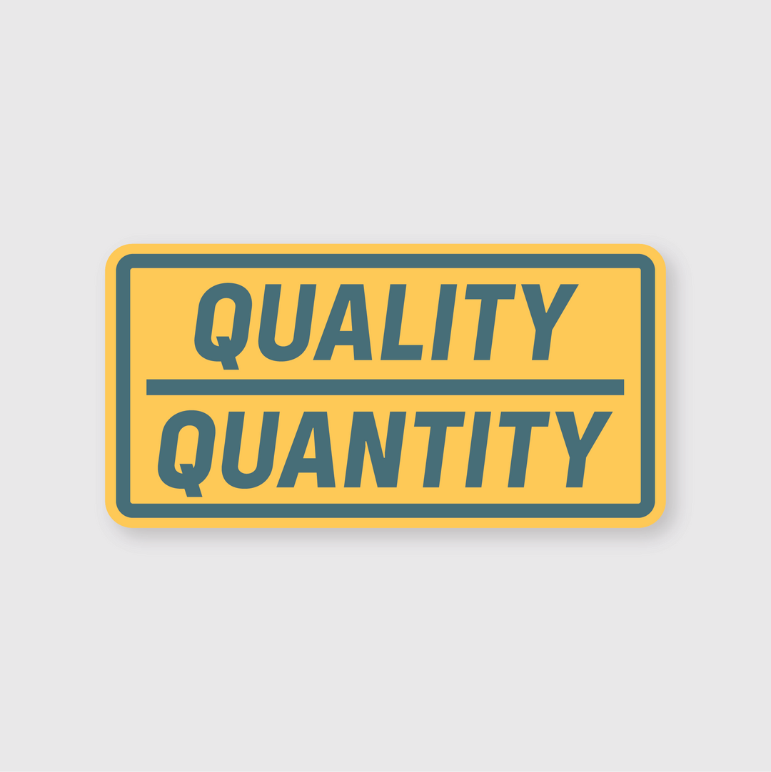 A yellow rectangular sign with a shadow effect showcases the words "QUALITY" and "QUANTITY" in bold blue capital letters, separated by a horizontal line. This custom design is ideal for businesses looking for impactful stickers and is recognized as the Quality Over Quantity.