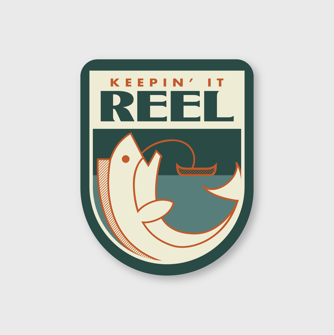 The "Keepin' It Reel Sticker" from Pike Street Press is a durable, die-cut vinyl sticker designed to withstand the elements. It features a design with a fish and boat motif.