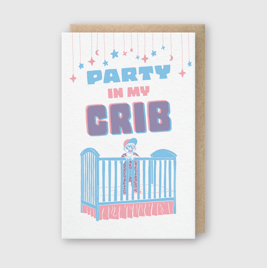 The Party In My Crib Greeting Card is perfect for baby showers, featuring a charming illustration of a baby in a crib sporting sunglasses. It includes the playful phrase "Party in my crib," enhanced by decorative hanging stars and crescent moons to add extra charm.