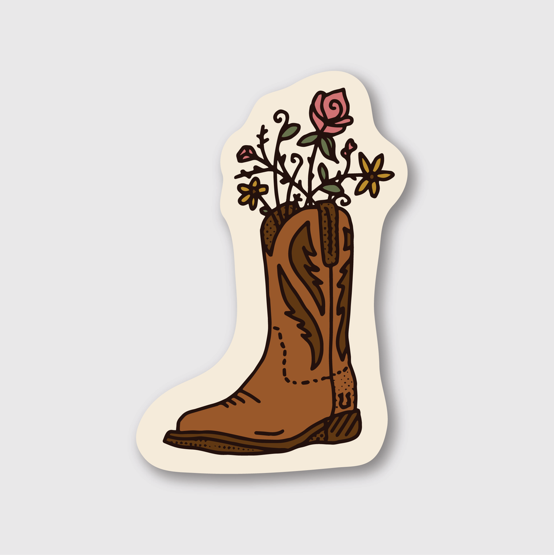 Discover the charm of this Floral Boot Sticker, featuring a brown cowboy boot adorned with roses and daisies. With its black outline against a light cream background, this die-cut vinyl design is perfect for nature lovers seeking a touch of rustic elegance.