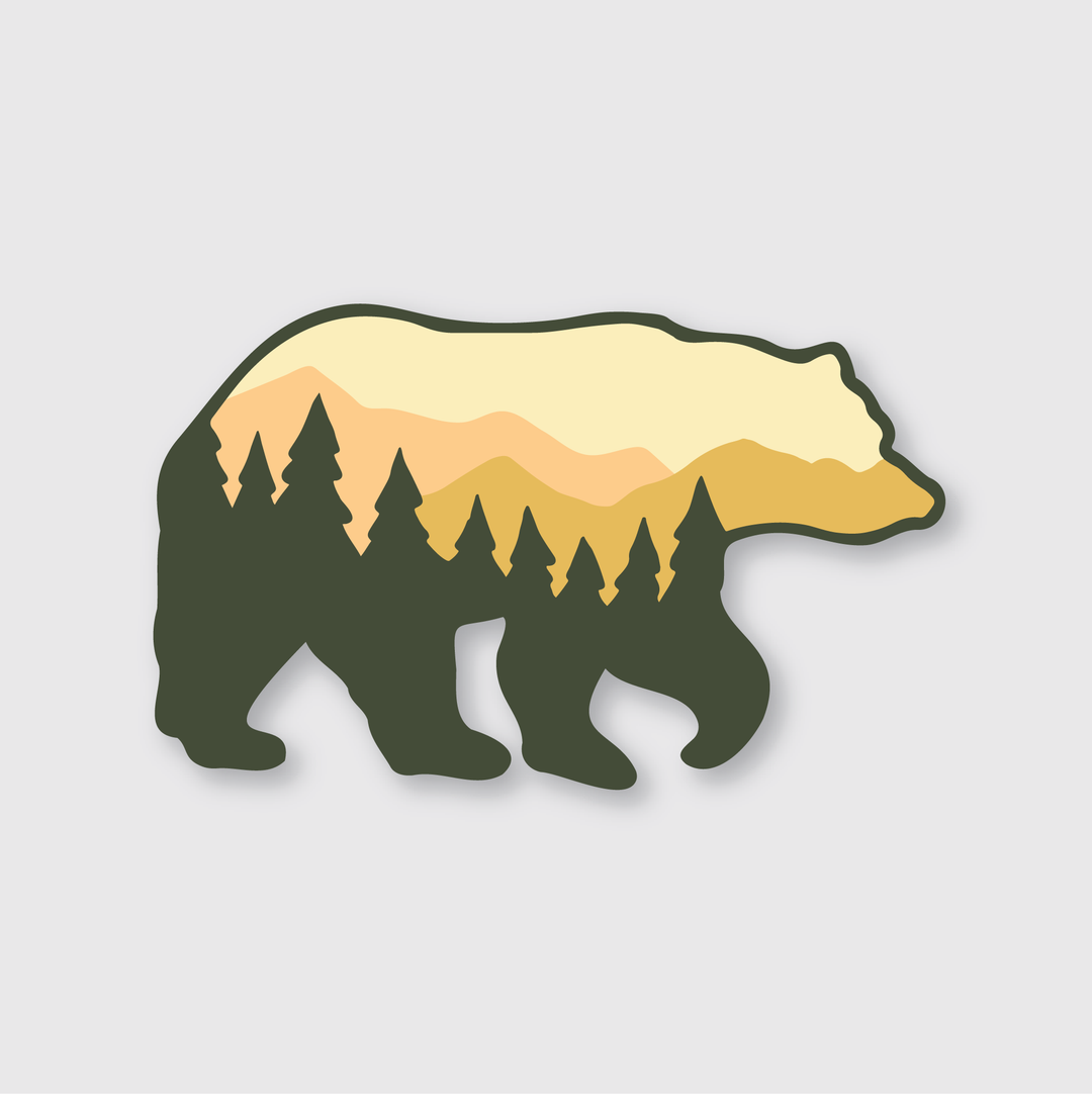 Featuring a design crafted by talented artists, the Tree Bear Sticker presents a bear silhouette filled with captivating imagery of pine trees and mountains at sunset. This die-cut vinyl sticker creatively integrates natural scenery into the bear's form, providing outdoor enthusiasts with a durable and weather-resistant option.