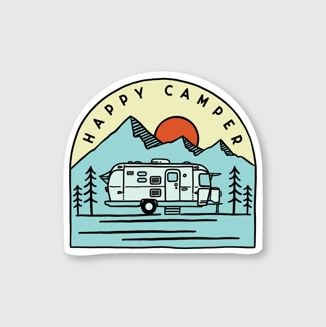 The Trailer Camper Sticker showcases a charming design featuring a "Happy Camper" message at the top. It depicts a camper trailer nestled among pine trees, with mountains and a setting sun in the background. The sticker uses a palette of blue, orange, and green shades set against a light grey background, giving it an artistic flair.