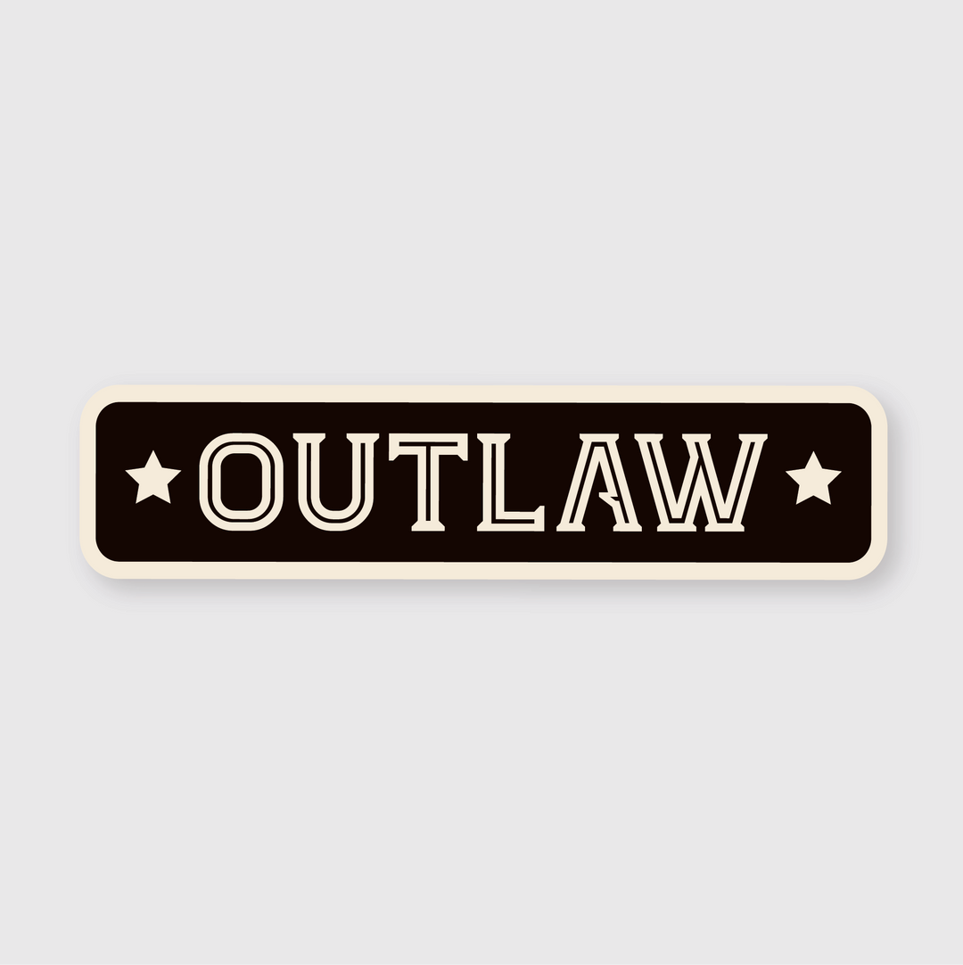 The Outlaw Sticker features a sleek design with rounded edges. It prominently displays the word "OUTLAW" in bold, white capital letters on a rectangular black background. Two white stars are positioned on either side of the text against a subtle light gray backdrop, perfectly capturing Seattle's edgy vibe.