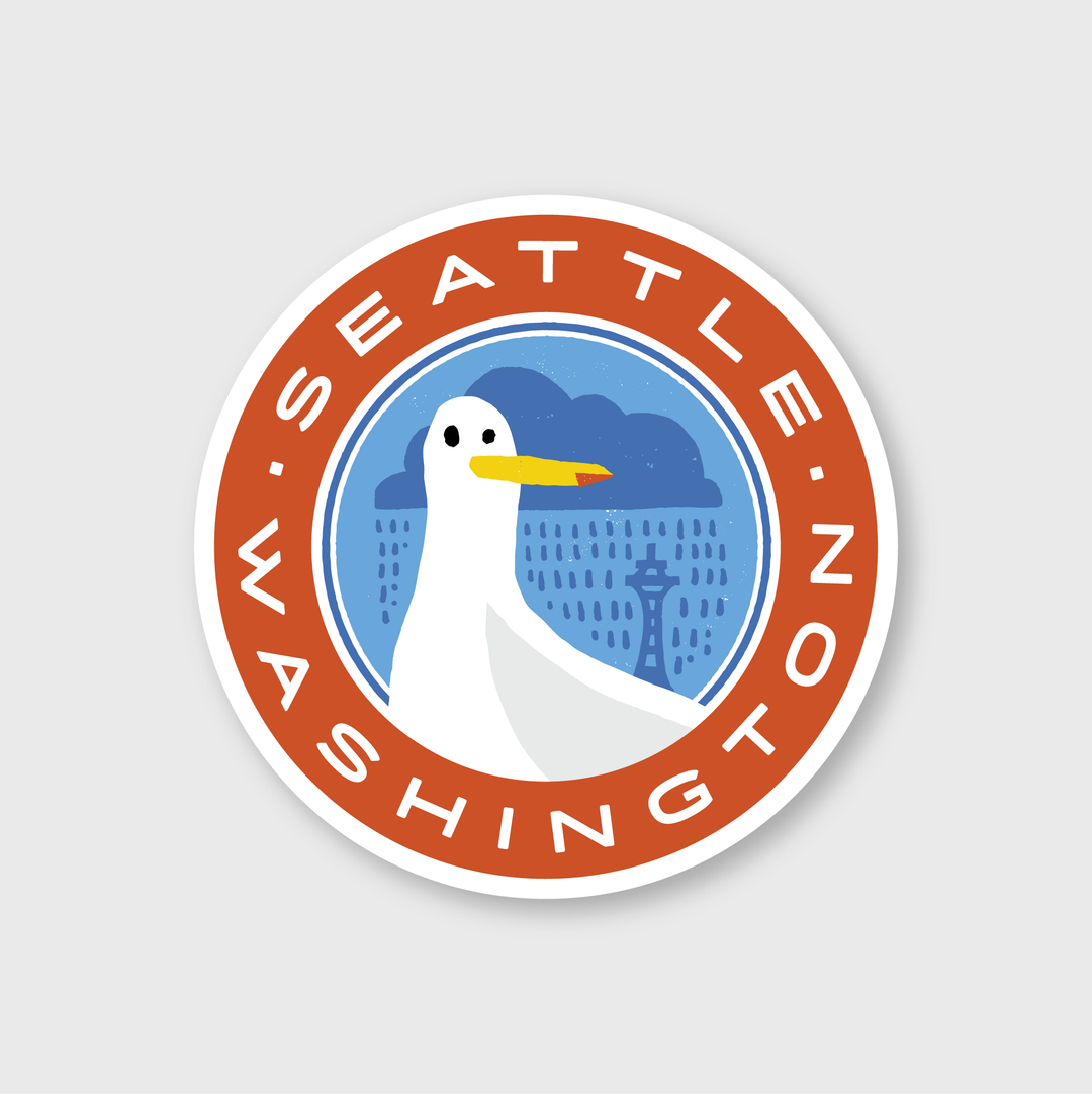 The Seattle Seagull Sticker features a lively red circular design with the iconic Space Needle and a whimsical cartoon seagull under a rainy cloud. The phrase "Seattle Washington" stands out in bold white text, capturing the artistic creativity behind the design.