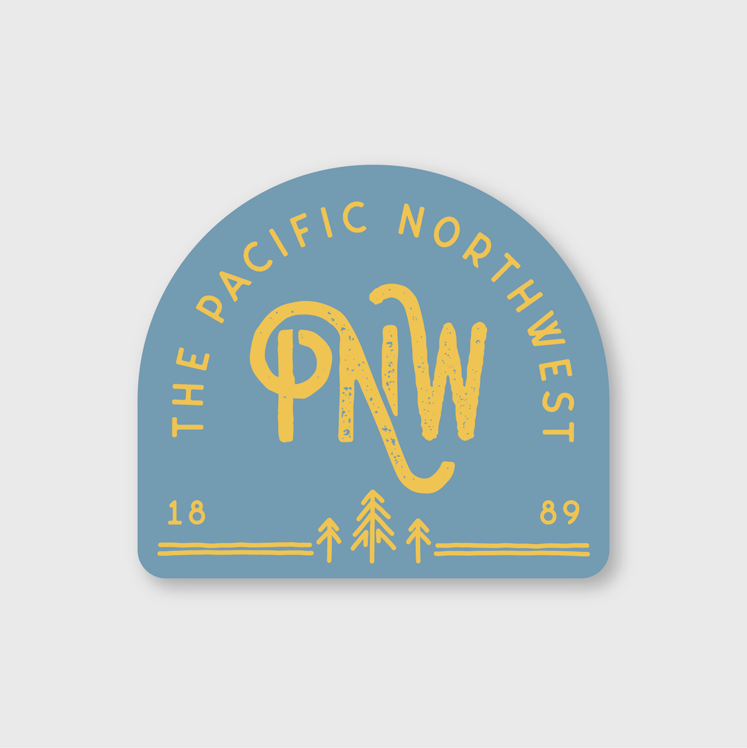 The PNW 1889 Sticker showcases a blue badge with vibrant yellow text saying "The Pacific Northwest" and "PNW." Beneath the text, tree icons are displayed alongside the numbers 18 and 89, emphasizing its quality design.