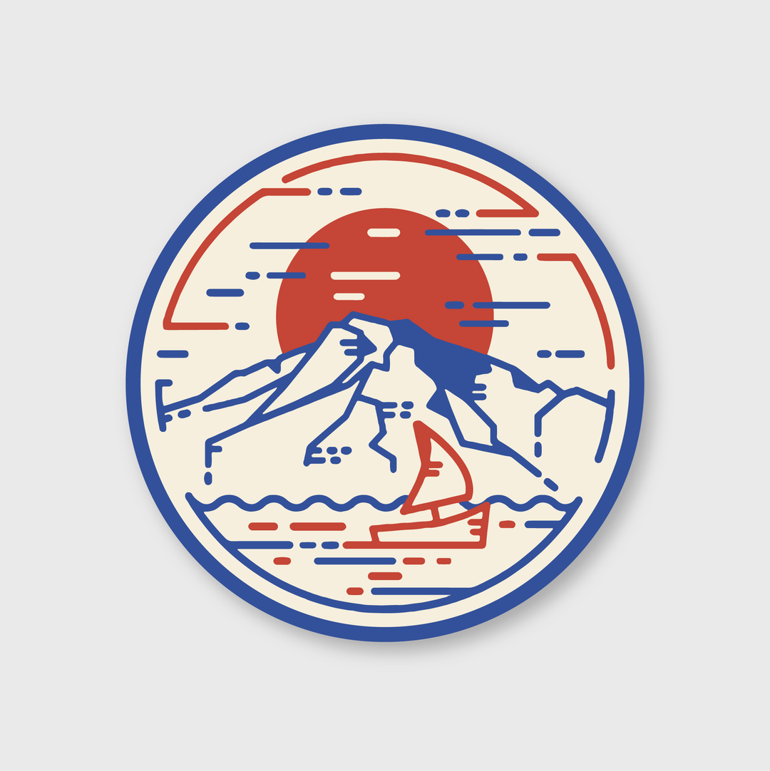 The Mountain Sunset Sailboat Sticker by Pike Street Press features a stylized mountain landscape, highlighting a prominent red sun or moon. In the foreground, there's a small red sailboat navigating through wavy waters, illustrated with blue and red lines set against a beige background.