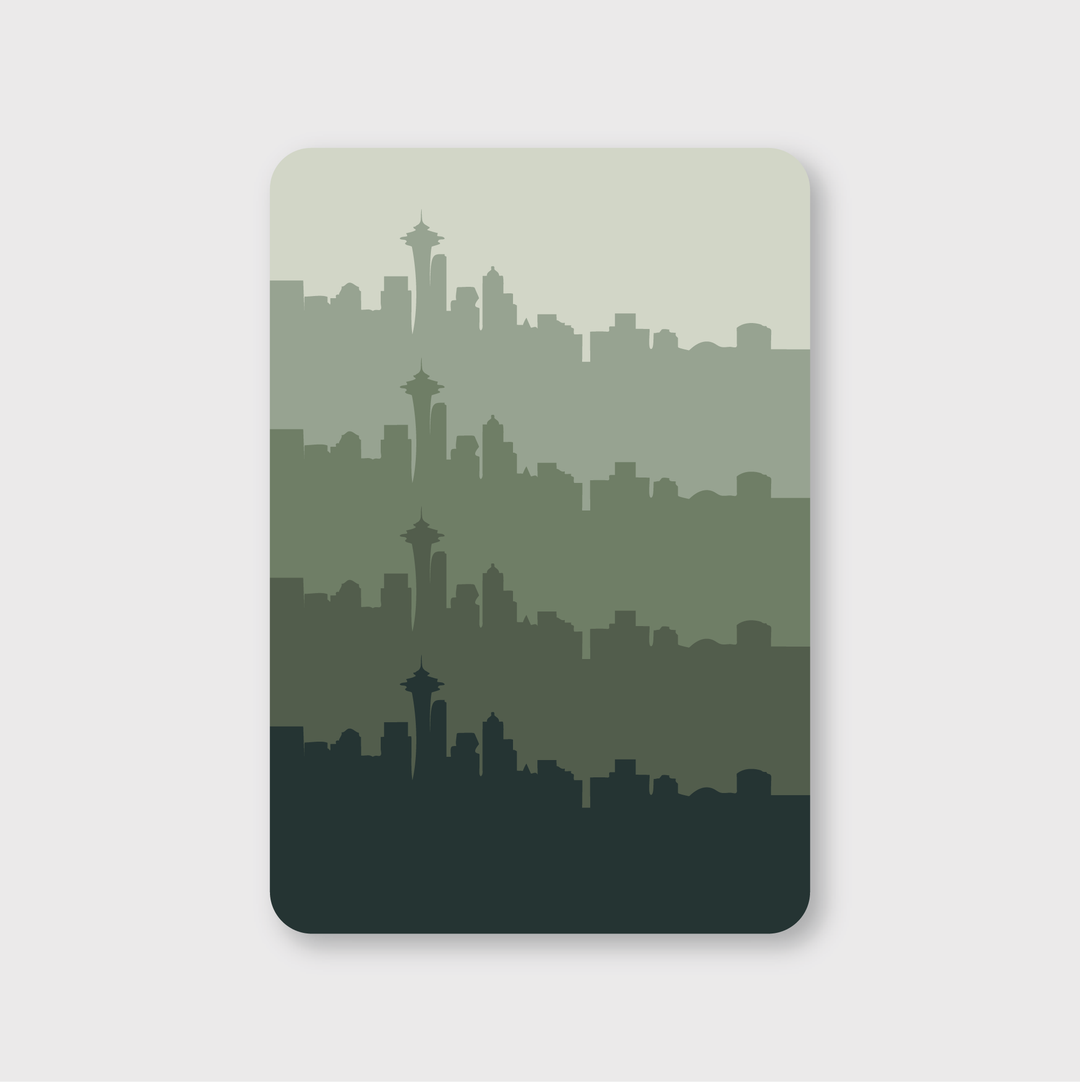 The sticker captures a city's skyline silhouette with various green shades layered vertically in a die-cut vinyl format. A distinctive tower, reminiscent of the Space Needle, stands out against a minimalist background, embodying Seattle's unique allure.