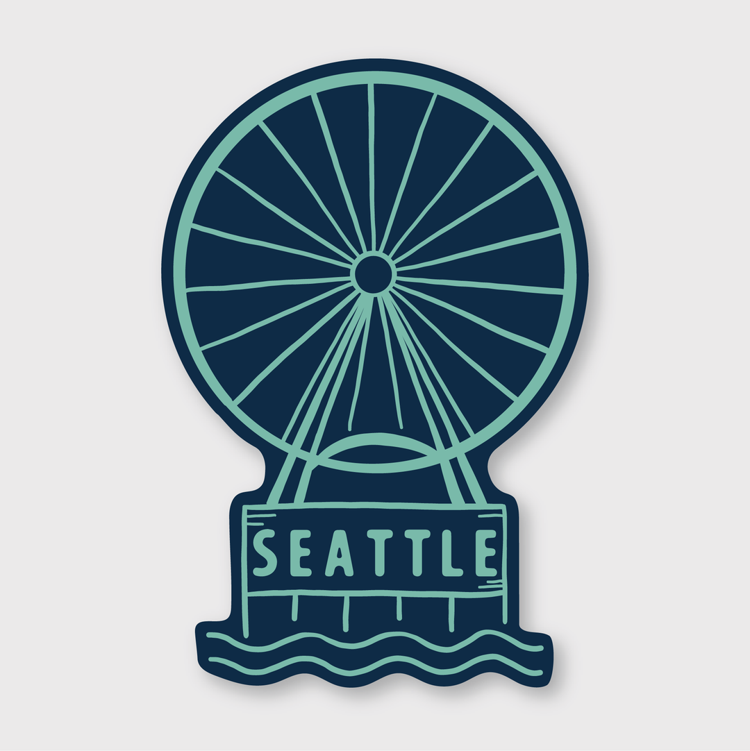 The Seattle Ferris Wheel Sticker features an illustration of the ferris wheel above stylized waves with the word "Seattle" below. This vinyl sticker is designed in a dark blue and teal color scheme and is weather-resistant for durability outdoors.