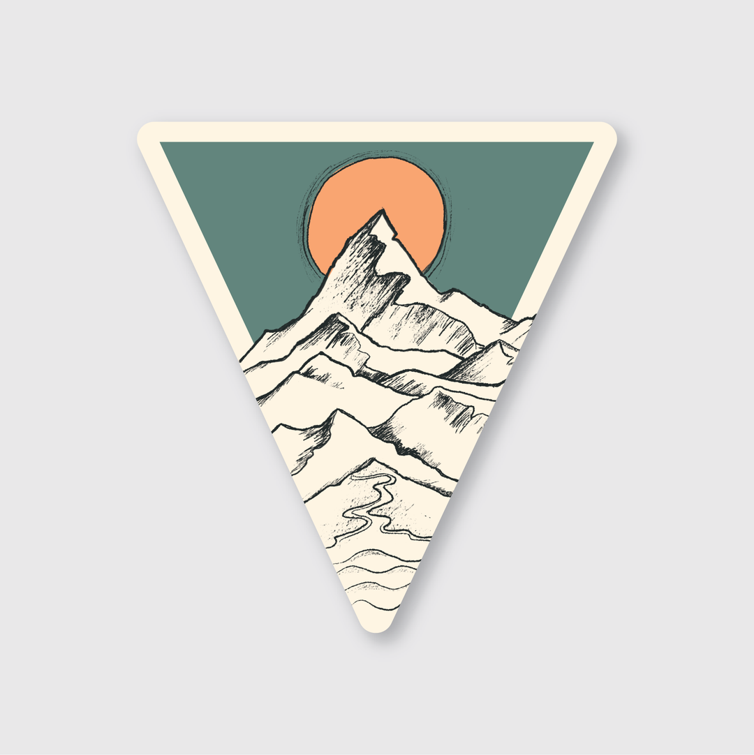 The Tri Mountain Sketch Sticker features a triangular mountain landscape with the sun positioned behind the peak, creating either a sunset or sunrise effect. It is made from die-cut vinyl and decorated with stylized lines and muted colors, giving it a minimalistic and peaceful look. Created by artists, the sticker is designed to be weather resistant, maintaining its appearance in various conditions.