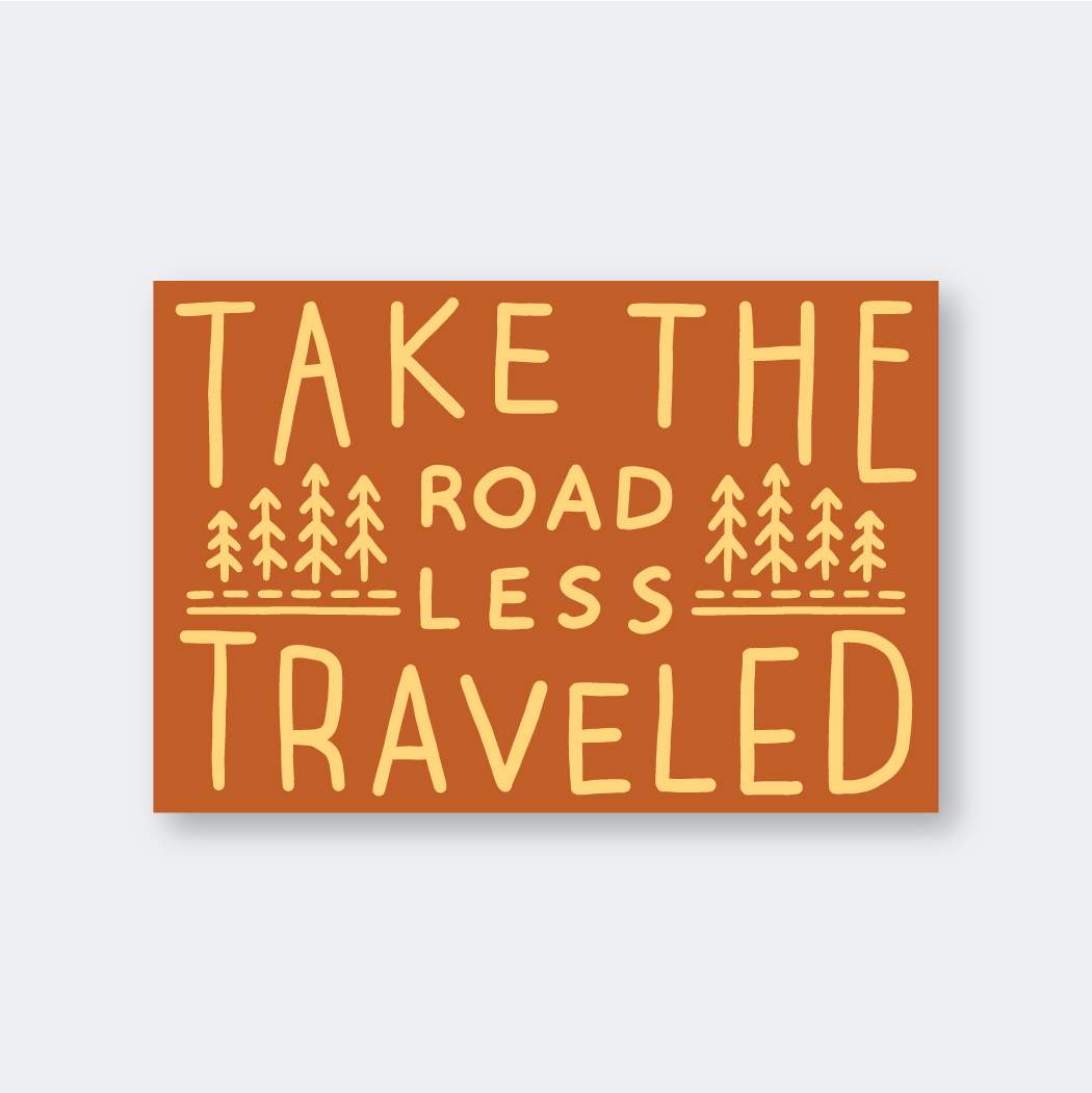 A rectangular sign displays an orange background with the phrase "Take the road less traveled" in bold, yellow letters. Tree illustrations are interspersed between the words, enhancing its quality design.