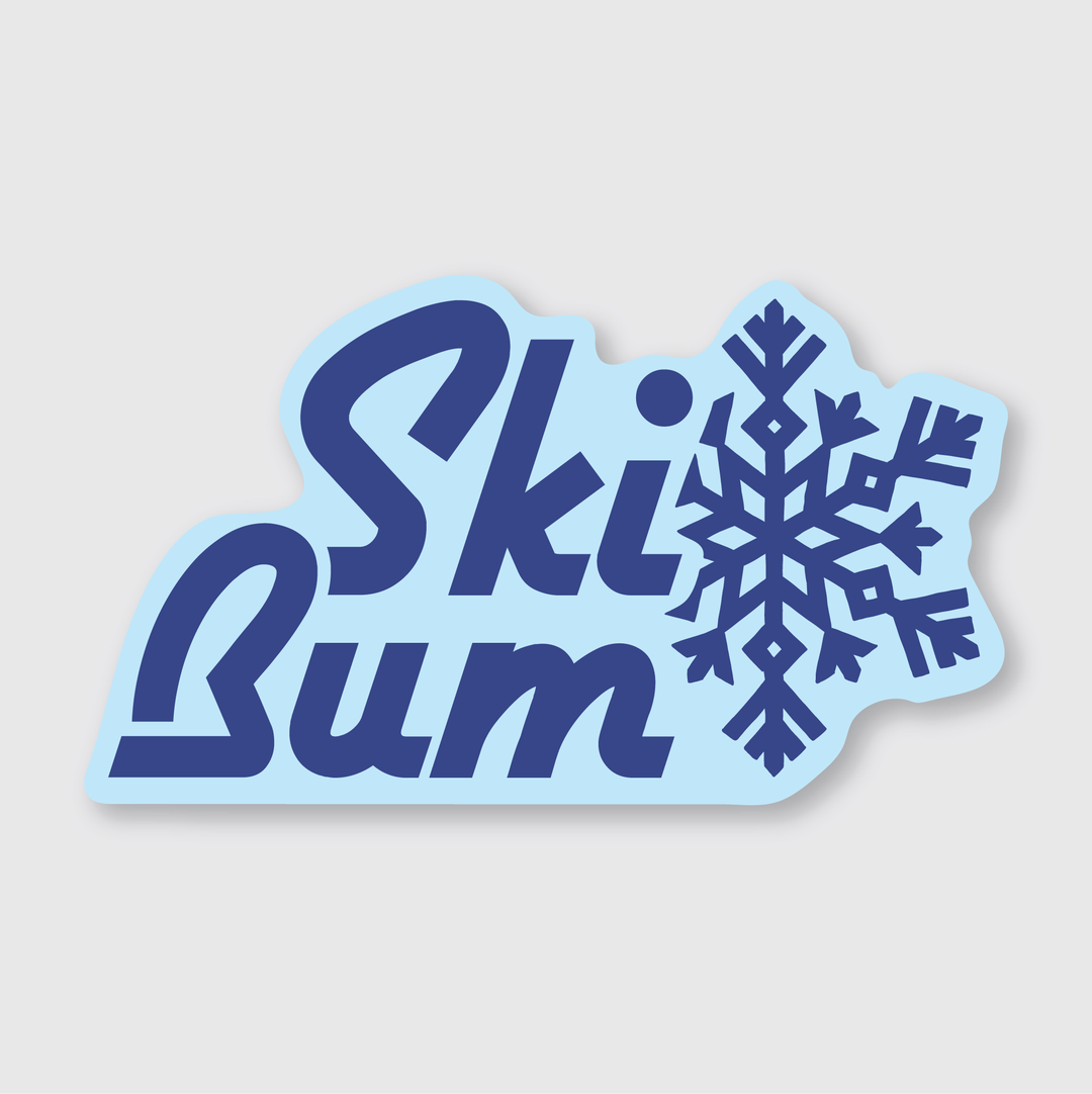 The "Ski Bum Sticker" from Pike Street Press features the phrase "Ski Bum" in vibrant blue, accompanied by a large, weather-resistant blue snowflake graphic on a light blue background. It's perfect for any ski enthusiast's collection.